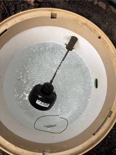 Pool autofill pot and float valve close-up in a North Phoenix backyard