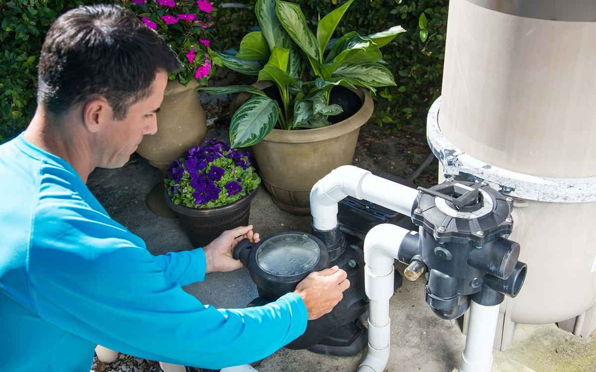 Technician installing a variable-speed pool pump in Moon Valley Phoenix